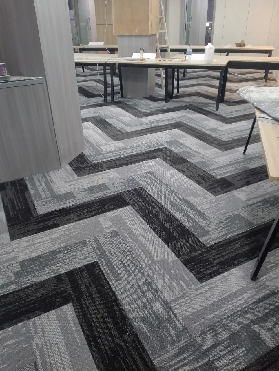 Wooden laminate flooring installed in a Pune home office
